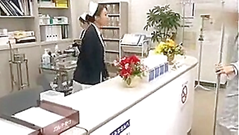 Dutiful Japanese Nurse Services Patient in Public Hospital. Dutiful Japanese Nurse Services Patient in Public Hospital.